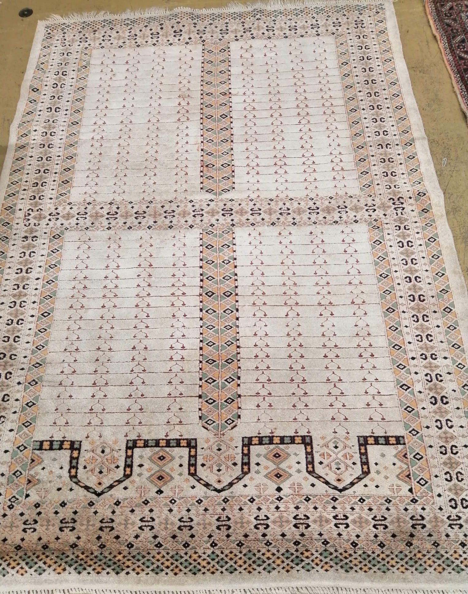 An ivory ground rug, 180 x 128cm